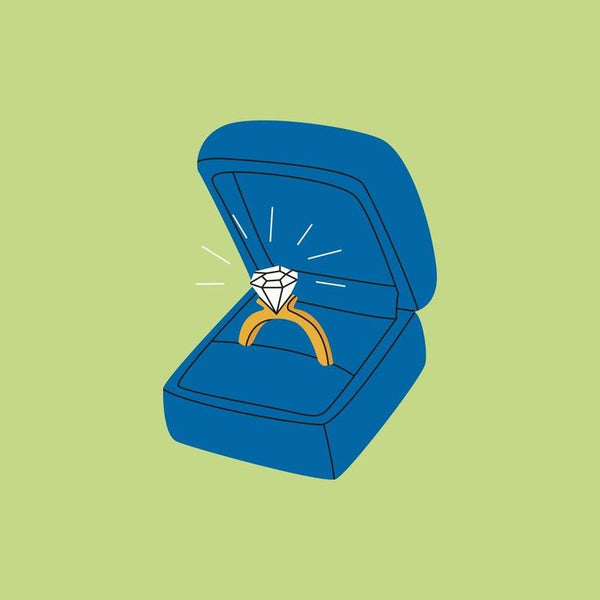 Ilustración de un anillo de diamantes en un estuche abierto